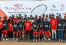 Dignitaries together with members of Special Olympics Ghana after the signing