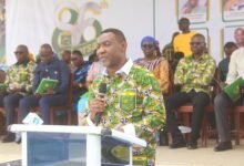 Rev. Lawrence Tetteh (inset) addressing students at the speech and prize-giving day. Photo Ebo Gorman