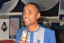 Mr Sam - Woode (inset) speaking at the programme
