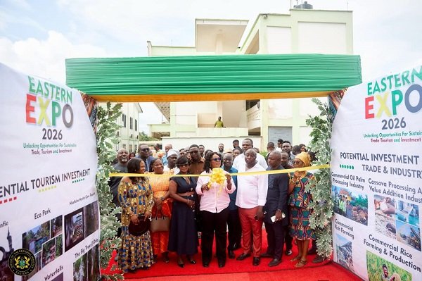 Mrs Awatey (middle) cutting the tape to open the expo