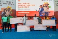 Award winners displaying their dummy cheques at the fair. Photo. Ebo Gorman
