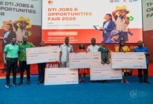 Award winners displaying their dummy cheques at the fair. Photo. Ebo Gorman.