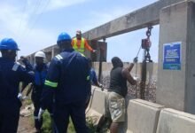 Some technical men working on the Havedzi floodgate
