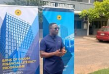 Mr Cudjoe (inset) addressing the students