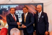 Mr Farihan Alhassan (middle) receiving his award at the event