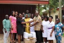 Dr Akoto (right) receiving the items