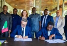 Mr Dreolini (left) and Mr Ankrah signing the MoU