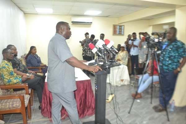 Mr Dwumfour (standing) addressing the media. Photo Victor A. Buxton