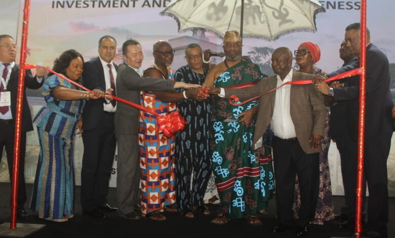 Ga Mantse, King Tackie Teiko Tsuru II (fifth from right), Mr Goosie Tanoh (sixth from left) and other invited guests cutting the tape to open the exhibition. Photo. Ebo Gorman