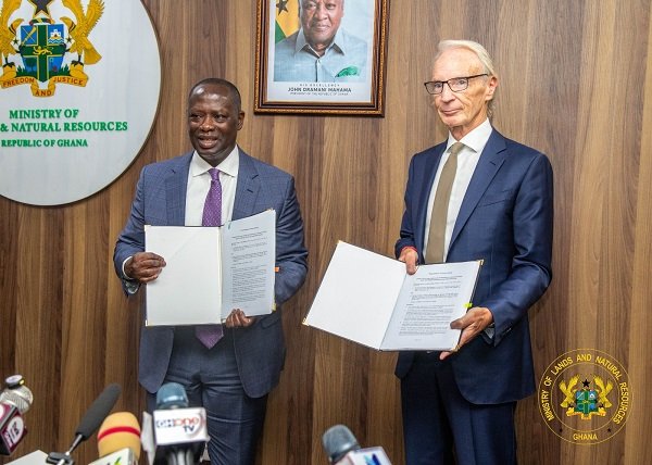 Mr Buah (left) and Mr Tait displaying the signed MOU