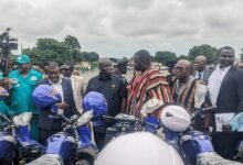 Mr Opoku (middle) and other officals from the ministry inspecting some of the motorbikes for the Brigadiers