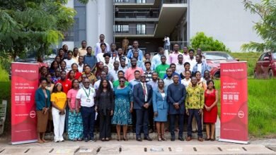 Absa officials with staff, and students after the event