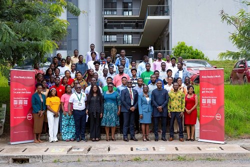 Absa officials with staff, and students after the event