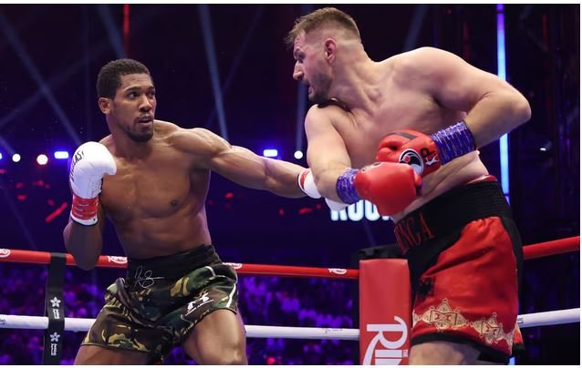 Joshua (left) recovered from two knockdowns to stop Prenga in the second round