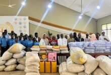 Chief Kabore (sixth from right) with his family, management and students of the school after the donation