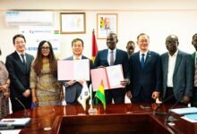 Mr Iddrisu (fourth from right) and Mr Park displaying the signed MoU at the ceremony