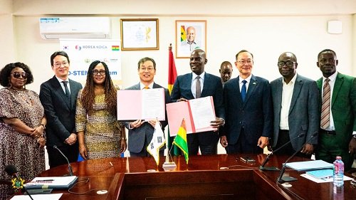 Mr Iddrisu (fourth from right) and Mr Park displaying the signed MoU at the ceremony
