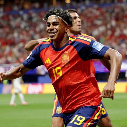 Spain's unbeaten 35 matches run under threat from Belgium Spain face Belgium today in a World Cup quarter-final that pits one of the tournament's smoothest operators against a side emboldened by a thunderous 4-1 win over the United States that followed one of football's most bizarre political interventions. Belgium's victory came after extraordinary drama when U.S. striker Folarin Balogun's one-match ban for a red card was suspended after President Donald Trump personally urged FIFA President Gianni Infantino to review the case. Rudi Garcia's Belgium answered with a four-goal thrashing, securing a place in the quarter-finals. Now comes a rather different examination. Spain are unbeaten in 35 matches, a run that has turned Luis de la Fuente's team from promising European champions into a team that exert confident control over their ⁠opponents. Since their surprise penalty shootout exit against Morocco in the last 16 of the 2022 World Cup in Qatar under Luis Enrique, Spain have been remodelled by De la Fuente, the former youth team coach who knows many of his current players from their formative years. The result is a national side that often plays with the cohesion of a club team: disciplined, organised, balanced and difficult to break down. Under De la Fuente, Spain won the Nations League in 2023, claimed a long-awaited fourth European Championship title in 2024 and reached another Nations League final the following year, losing on penalties to Portugal after a 0-0 draw. Portugal, featuring Cristiano Ronaldo, were also Spain's last victim’s in ⁠this World Cup, beaten 1-0 by a last-gasp goal that underlined one of their major strengths their substitutes. Mikel Merino scored the winner after coming off the bench, with fellow substitute Ferran Torres providing the assist only minutes after entering the match. Spain's strength is not built around one obvious match-winner, but in collective depth. At Euro 2024, they scored 15 goals, with 10 ⁠different players finding the net a tournament record for the number of scorers in one team in a single edition. Even teenage sensation, Lamine Yamal, still regaining sharpness after a hamstring injury in April, has shown that short bursts of his invention are ⁠enough to disrupt defences and create space for teammates. Belgium, meanwhile, must try to derail Spain without Amadou Onana, who ruptured his anterior cruciate ligament during the win over the United States. The midfielder went off in the 21st ⁠minute after landing awkwardly, though he later joined the celebrations on crutches. His absence leaves Garcia with a sizeable gap to fill against a Spain side who rarely need an invitation to take control. However, Belgium have already shown they can rise to the challenge when facing adversity. - Reuters CAPTION Lamine Yamal