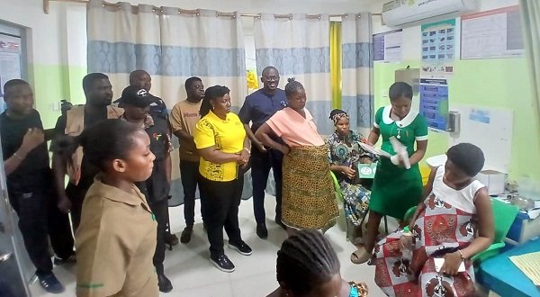 MTN Foundation Maternity------Mr Iddrisu (fifth from right) and other Foundation members in one of the wards during the visit