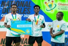 Men's Doubles winners Ahmad Abdul Samad and Ebenezer Kwame Korampong with Badminton President Evans Yeboah