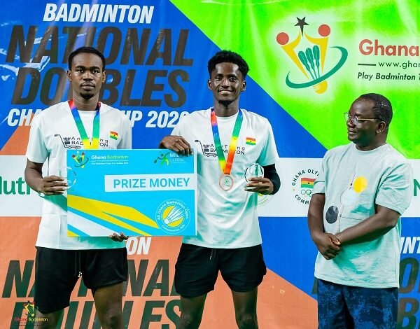 Men's Doubles winners Ahmad Abdul Samad and Ebenezer Kwame Korampong with Badminton President Evans Yeboah