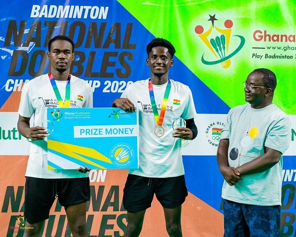 Men's Doubles winners Ahmad Abdul Samad and Ebenezer Kwame Korampong with Badminton President Evans Yeboah