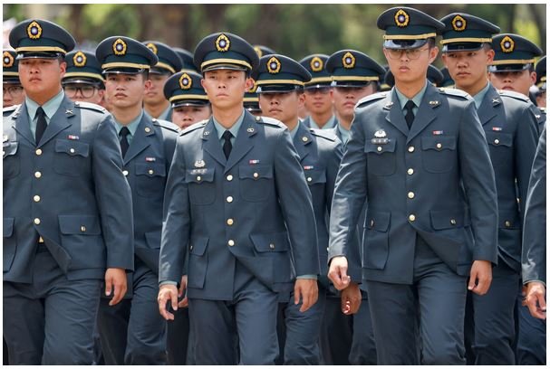 Military cadets march during a graduation ceremony in Taipei last week