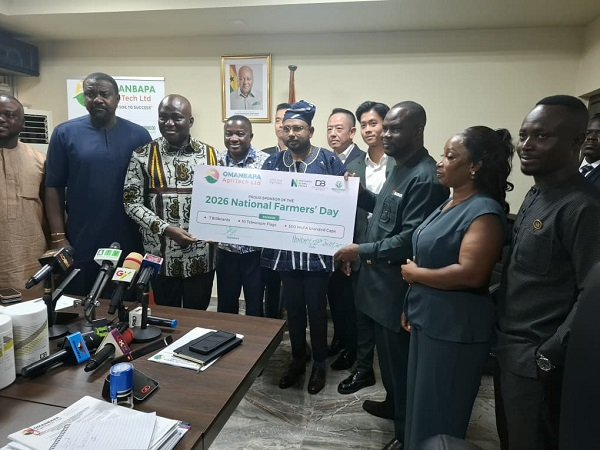 Mr Eric Opoku (third from left) receiving the dummy cheque from Mr Takyi