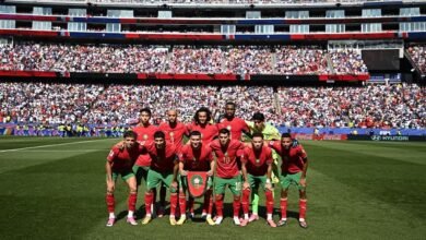 Morocco players posing for a team photo before a match