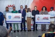 Mr Jihad Hijazi, (third from left) and Fadi Fatal with Mrs Amoh (middle) and officials of the two teams after the sponsorship signing