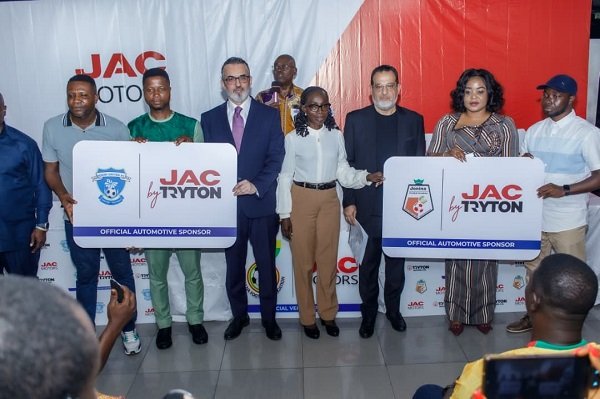 Mr Jihad Hijazi, (third from left) and Fadi Fatal with Mrs Amoh (middle) and officials of the two teams after the sponsorship signing