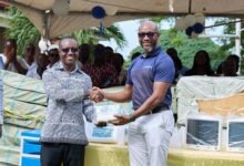 Mr Johnson (right), handing over the equipment to Prof. Gordon Abeka Nkrumah