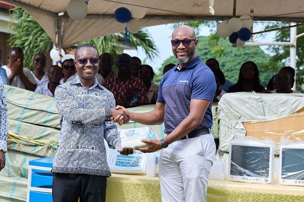 Mr Johnson (right), handing over the equipment to Prof. Gordon Abeka Nkrumah