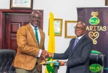 Alhaji Abdul-Salam (left) exchanging the signed document with Mr Boateng