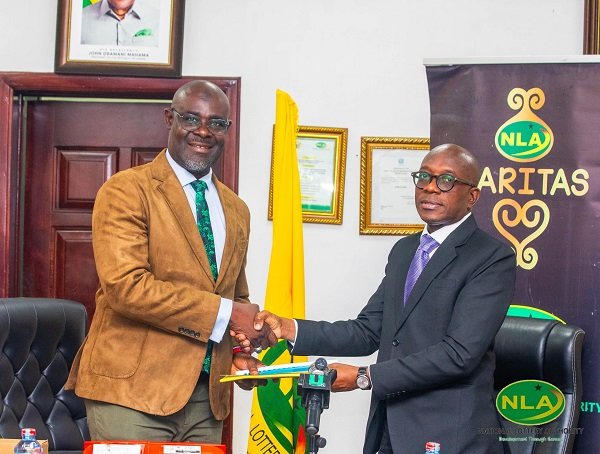 Alhaji Abdul-Salam (left) exchanging the signed document with Mr Boateng