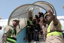 Nigerian nationals disembark from an aircraft, as authorities repatriate citizens fleeing xenophobic attacks in South Africa,
