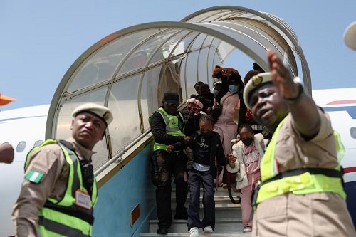 Nigerian nationals disembark from an aircraft, as authorities repatriate citizens fleeing xenophobic attacks in South Africa,