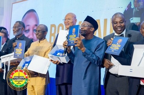 Mr Bagbin (second from right) being assisted by other dignitaries to launch the book