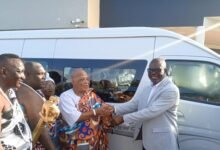 Mr Nunekpeku (right) presenting the keys to the vehicle to Nii Dzalesane