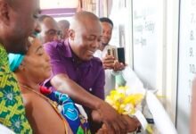 -Nana Afia Serwaa ‌and Mr Solomon Twum Barima jointly cutting the tape to open the SIC Life office