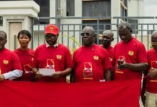 Mr Tetteh, (middle) addressing the press conference