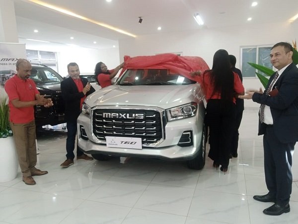 The Country director of stallion automobile industry limited ,Mr Ganesh Phadale second from left with other dignitaries unveiling the car.