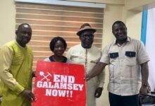 Mr. Ashigbey, (third from left), Mr. Daryl Bosu (right) and others displaying a placard at the press conference