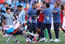 Thiago Almada and Leandro Paredes throw Gavi to the ground as Roberto Ayala appears to hold Eric Garcia around the throat