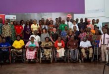Absa team with PWDs after the programme