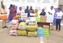 Major (Rtd) Joseph Kuyon (fourth from left) receiving the items from Ms Sobya Sadhwani during the presentation. With them is Dr Mohammed Awal (middle) Photo Victor A. Buxton