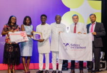 Mrs Oduro, (second from left) presenting an award to Nana Kwaku Amoako Oduro Mensah(fourth from right), from Galaxy International School as the overall student, while other dignitaries look on