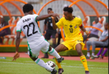 Ghana's Kelvin Nkrumah battles for the ball with Sabi