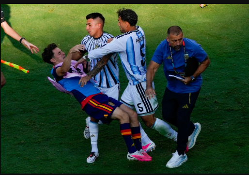 Argentina's Leandro Paredes push Spain substitute Gavi after the final whistle