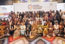 Mr Camara (seated fourth from left) with dignitaries and participants during the conference